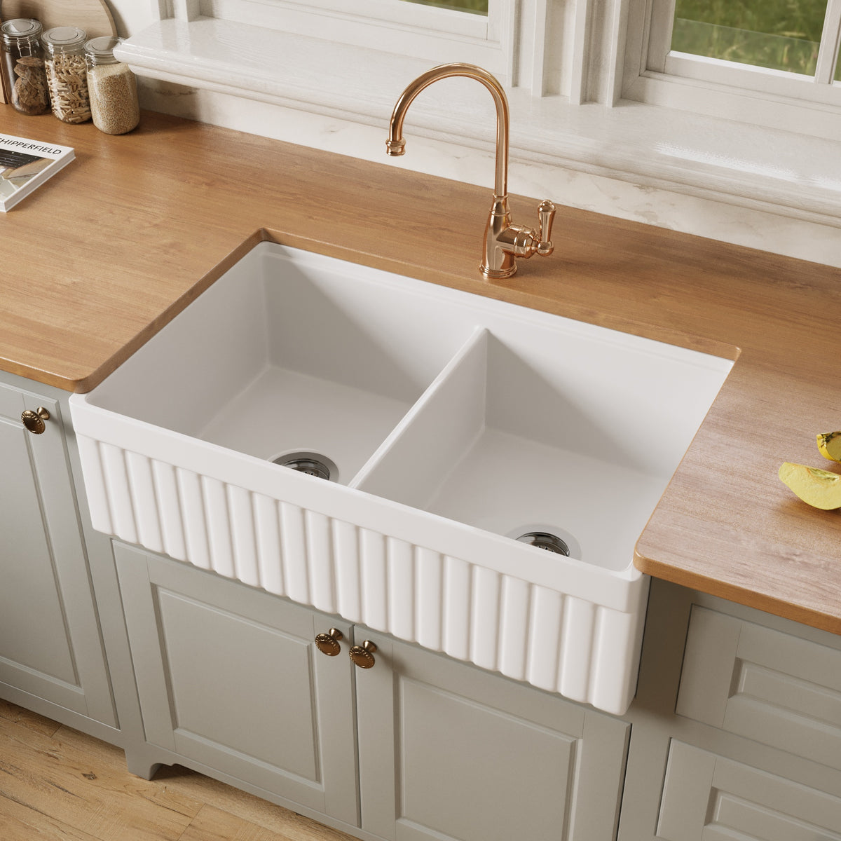 33 inch fireclay double bowl farmhouse sink with the fluted apron side facing out, showing equal 50/50 bowls and two drains