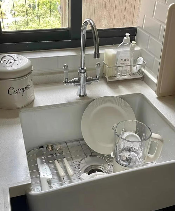 Design preview, sage paneled cabinets with brass faucet