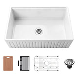 33 inch fluted fireclay farmhouse workstation sink with cutting board, utensil holder, roll-up drying rack, stainless steel bottom grid, and drain assembly.