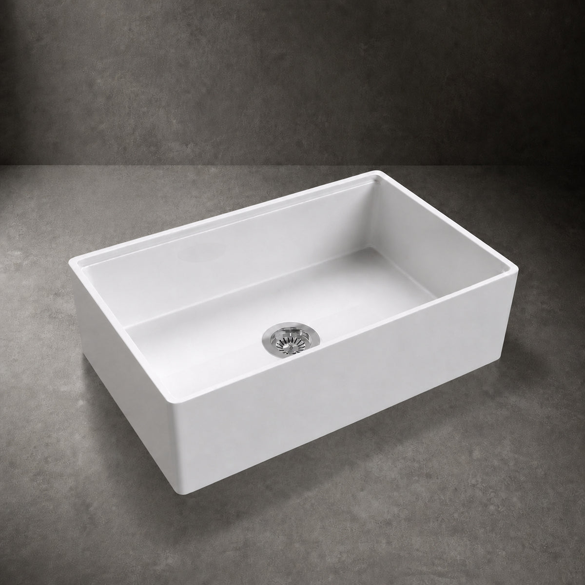 NOZLOO 33 inch smooth apron fireclay farmhouse sink, 45-degree studio view with strainer drain