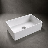 NOZLOO 33 inch smooth apron fireclay farmhouse sink, 45-degree studio view with strainer drain