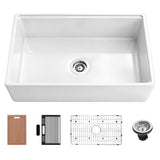 33 inch smooth apron fireclay farmhouse sink with cutting board, utensil holder, roll-up drying rack, bottom grid, and drain assembly.