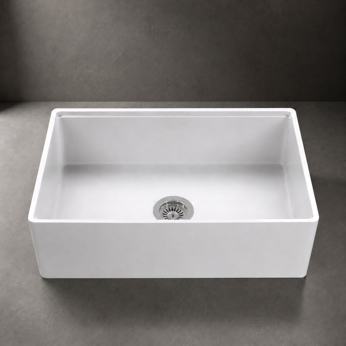 NOZLOO 33 inch smooth apron fireclay farmhouse sink, front close-up with strainer drain