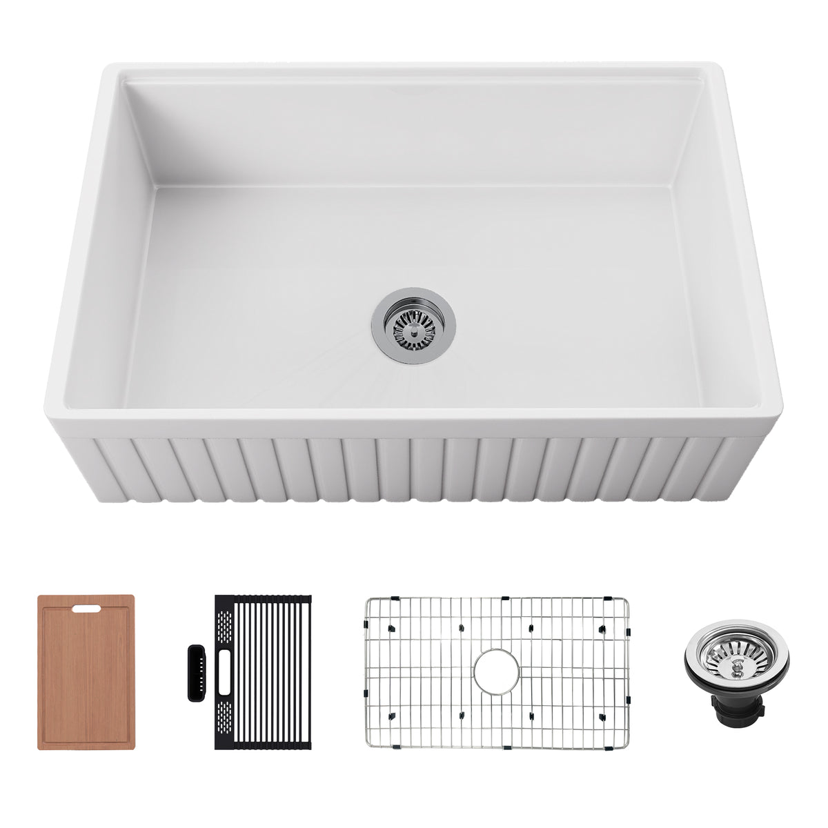 White reversible ribbed apron fireclay farmhouse sink with workstation accessories including cutting board, rack, grid, and drain