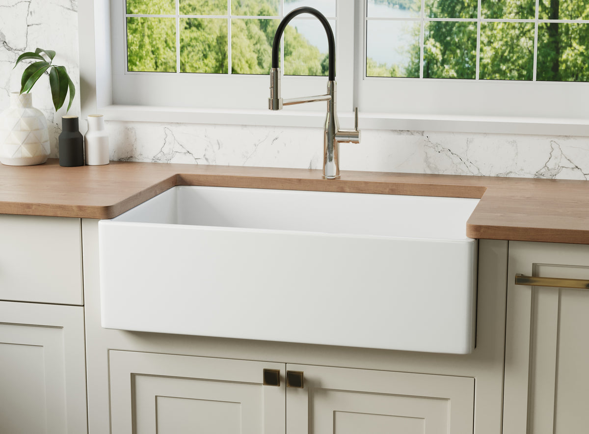 reversible apron fireclay farmhouse sink with flat front in bright kitchen
