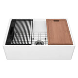 NOZLOO 33-inch smooth apron fireclay farmhouse workstation sink with sapele cutting board, roll-up drying rack, black colander, and stainless steel bottom grid on a white background