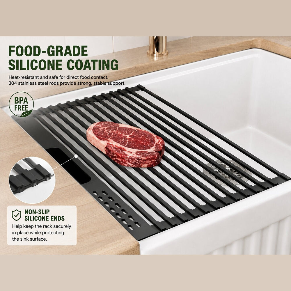 Black silicone-coated roll-up rack over a white fireclay sink, holding a steak with BPA-free, non-slip ends.